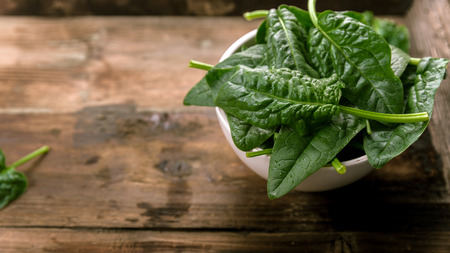 Freshly picked spinach on a background