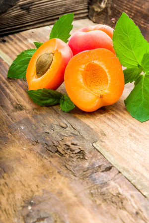 Apricots on a underground with fresh mintの写真素材