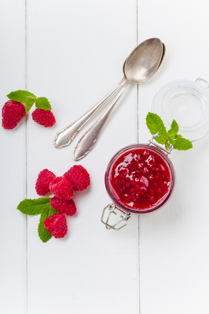 Raspberry jam with mint and fresh berries