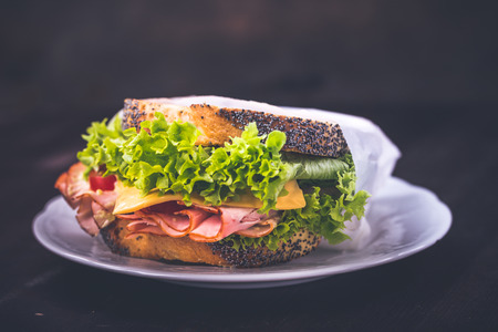 Sandwich with lettuce, cheese and sausageの写真素材