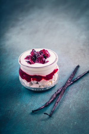 Dessert with meringue, cream and cranberryの写真素材