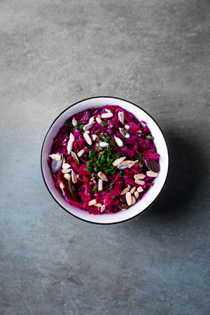 Red cabbage salad with beetroot, chives and various seedsの写真素材