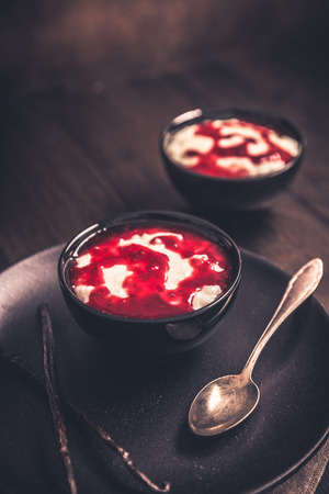 Delicious milk rice with raspberry sauce and vanilla freshly preparedの写真素材