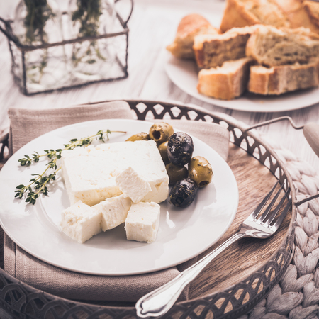 Feta cheese with olives and herbsの写真素材