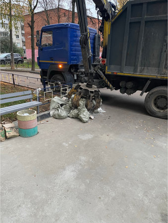 Truck with a crane unloads waste.の写真素材