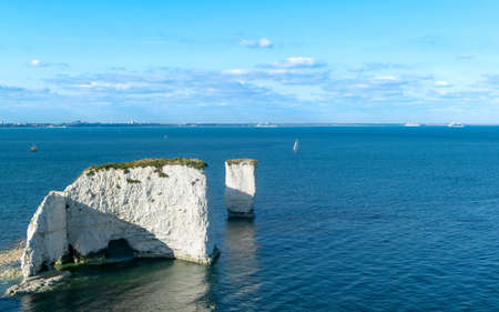 Old Harry Rocks are three chalk formations, located at Handfast Point, on the Isle of Purbeck in Dorset, southern England. Popular tourist destination coastal view by the sea in south United Kingdomの写真素材