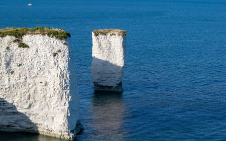 Old Harry Rocks are three chalk formations, located at Handfast Point, on the Isle of Purbeck in...