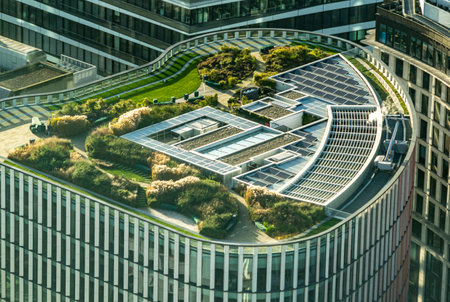 London, UK- 15 Dec 2020: Top view of the high building of Wells Fargo with green and lush roof garden and solar panels in London by the 33 King William St. Sustainable business approach and use of the roof.のeditorial素材