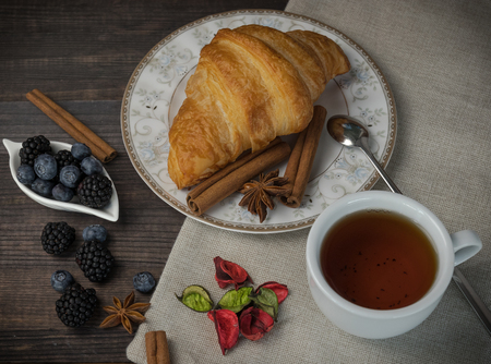 Breakfast with croissants, leaves. Flat lay, top viewの写真素材