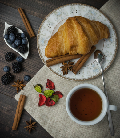 Breakfast with croissants, leaves. Flat lay, top viewの写真素材