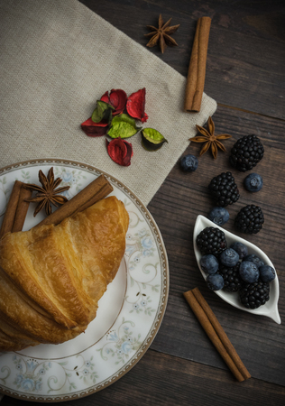 Breakfast with croissants, leaves. Flat lay, top viewの写真素材