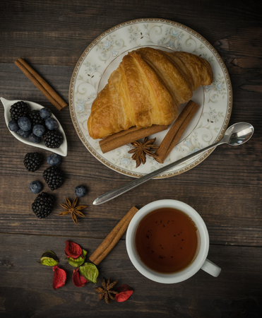 Breakfast with croissants, leaves. Flat lay, top viewの写真素材