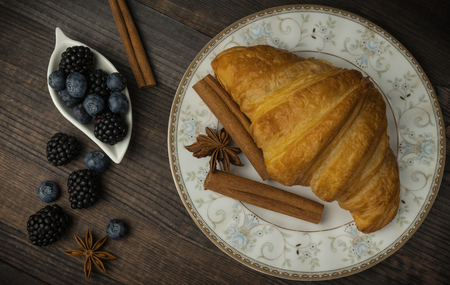 Breakfast with croissants, leaves. Flat lay, top viewの写真素材