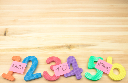 Back to school concept on a wooden background.school time. bright rooms on a wooden tableの写真素材