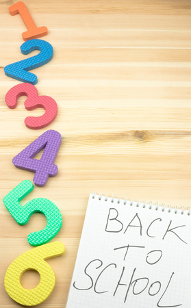 Back to school concept on a wooden background.school time. bright rooms on a wooden tableの写真素材