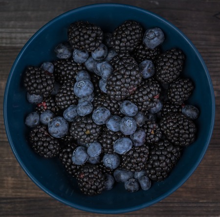 Blackberry on a wooden background. season of vitamins. berry day.の写真素材