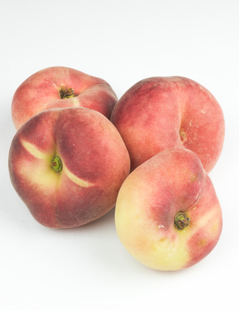 A group of whole nectarine fruits isolated on a white background. useful fruit. seasonal fruits.の写真素材