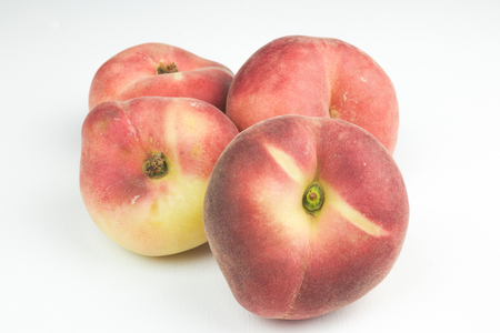 A group of whole nectarine fruits isolated on a white background. useful fruit. seasonal fruits.の写真素材