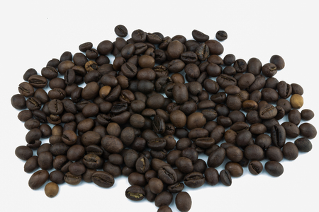 a coffee pile on a white background. grains of coffee.Isolator on white background.の写真素材