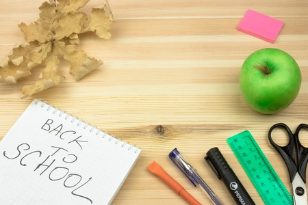 School accessories on yellow background. Minimal style. Flat lay. Copy space. Top viewの写真素材