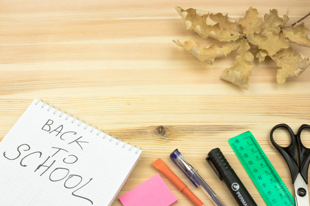 School accessories on yellow background. Minimal style. Flat lay. Copy space. Top viewの写真素材