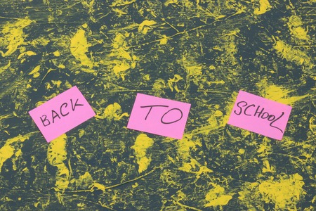 School accessories on yellow background. Minimal style. Flat lay. Copy space. Top viewの写真素材