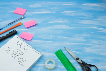 School accessories on yellow background. Minimal style. Flat lay. Copy space. Top viewの写真素材