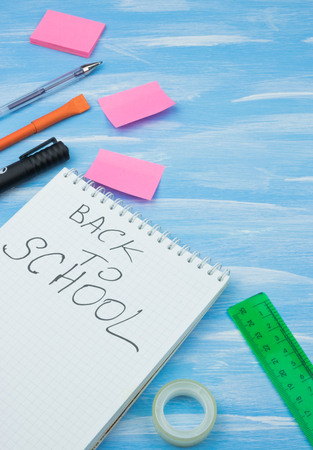 School accessories on yellow background. Minimal style. Flat lay. Copy space. Top viewの写真素材