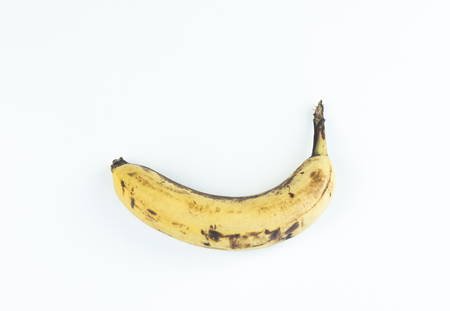 Ripe yellow bananas fruits, bunch of ripe bananas with dark spots on a white background with clipping path.の写真素材