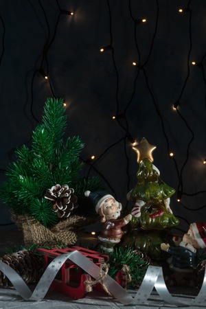 Christmas holiday, a picture of a Christmas tree without ornaments in a pot with Christmas decorations. christmas cardの写真素材