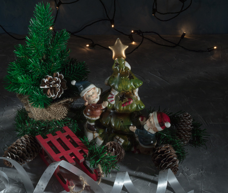 Christmas holiday, a picture of a Christmas tree without ornaments in a pot with Christmas decorations. christmas cardの写真素材