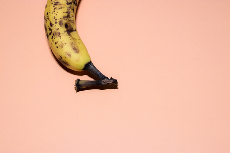 Single overripe banana isolated over white backgroundの写真素材