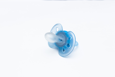 blue babys pacifier isolated on white backgroundの写真素材