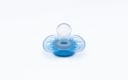 blue babys pacifier isolated on white backgroundの写真素材
