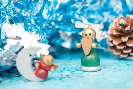 Composition Christmas holidays Christmas toys on a blue background with Christmas decorations. A bunch of Christmas toys and tinsel, while happy waiting for the New Year holidays. New Year card. festive background.の写真素材