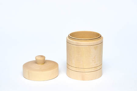 Herbal honey wooden jar. container for storing honey. insulator on white background.の写真素材