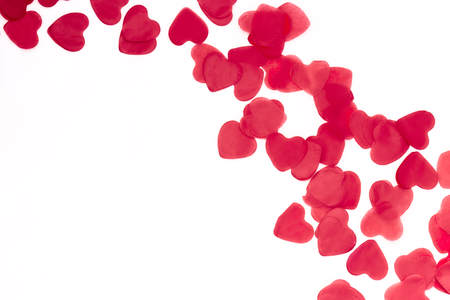 scattered red hearts on a white background. Excellent background to the day of Saint Valentine.の写真素材