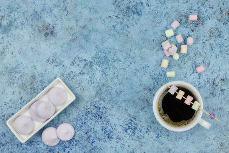 white cup of coffee on the table. view from above. place for text.