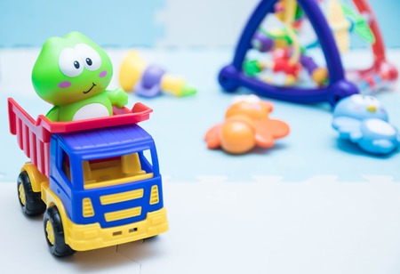 Children's toys. A small machine close-up for children. playing mat with children's toys.の写真素材
