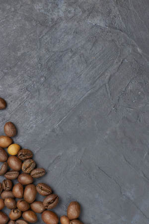 coffee beans loose in the corner of the background. on a dark background. view from above. copy space.の写真素材