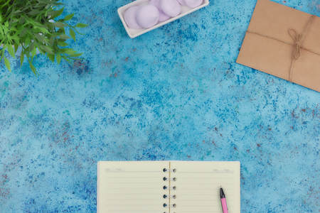 concept of recording your daily affairs on your desktop. Notepad on a blue abstract background. Copy...