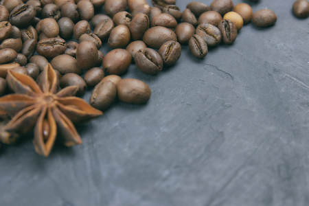 coffee beans loose in the corner of the background. on a dark background. view from above. copy space.の写真素材