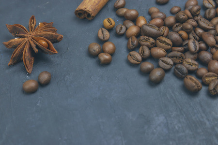 coffee beans loose in the corner of the background. on a dark background. view from above. copy space.の写真素材