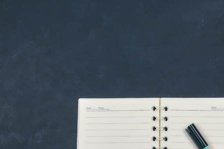 Office dark table. Empty booklet layout, brochure, diary, business portfolio mockup design template on black background. top view, copyの写真素材