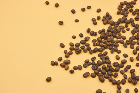 coffee beans loose in the corner of the background. on a dark background. view from above. copy space.の写真素材