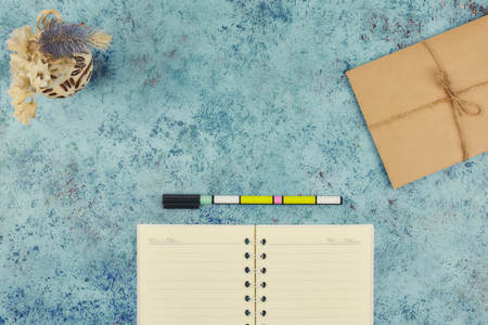 Notepad for text on pink table with copy space. Education and office conceptの写真素材