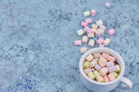 coffee drink with marshmallows and spices. on a dark background. view from above. copy space.の写真素材