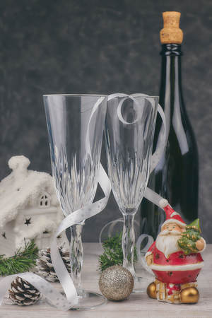 composition with Christmas decorations. empty champagne glasses. new year, table theme. horizontal view. christmas postcard.の写真素材
