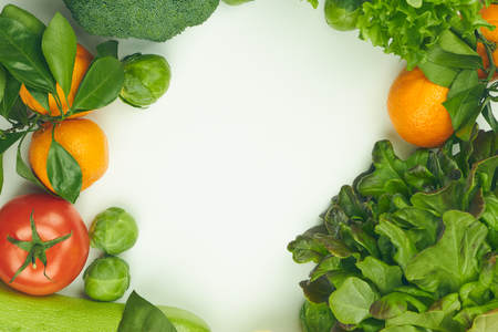 Group of fresh vegetables on white background. there is space for text in the center. copy space.の写真素材