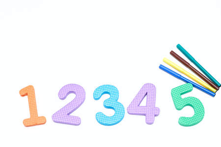 colorful markers on white background with colored numbers. childrens markers for drawing. copy space. the view from the top. the concept of the school.の写真素材